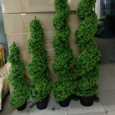 Artificial boxwood hedge outdoor using topiary grass